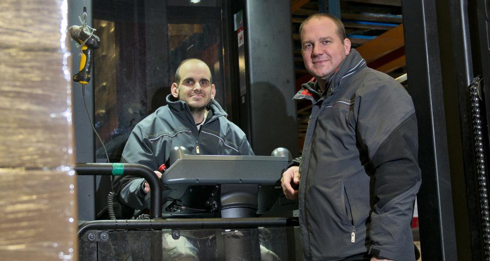 Afbeelding: man op heftruck in magazijn